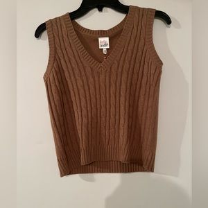 small brown sweater vest from the brand “belle du jour”